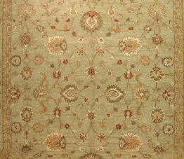 Close-up of floral design on handmade Oushak reproduction fine wool rug