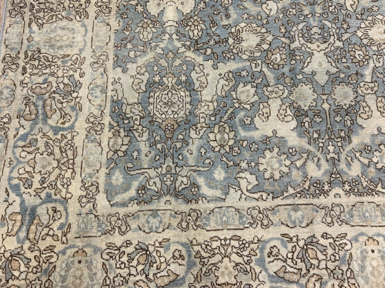 "Antique Tabriz Handmade Rug: Approx. 8' x 10'. Exquisite allover design with fine weave showcasing shades of blue. Versatile thin pile suitable for dining rooms, living rooms, and bedrooms. A true masterpiece for any space."