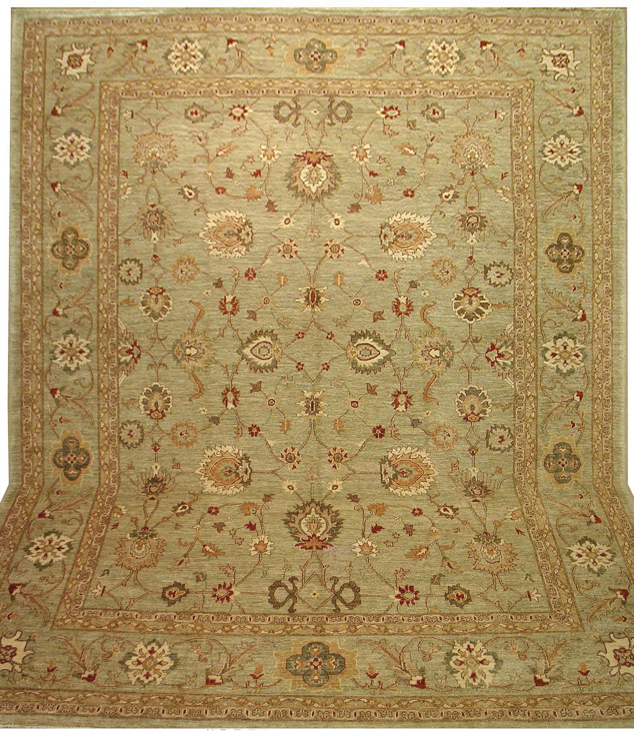 Antique Oushak reproduction rug with sage green background and floral wool design