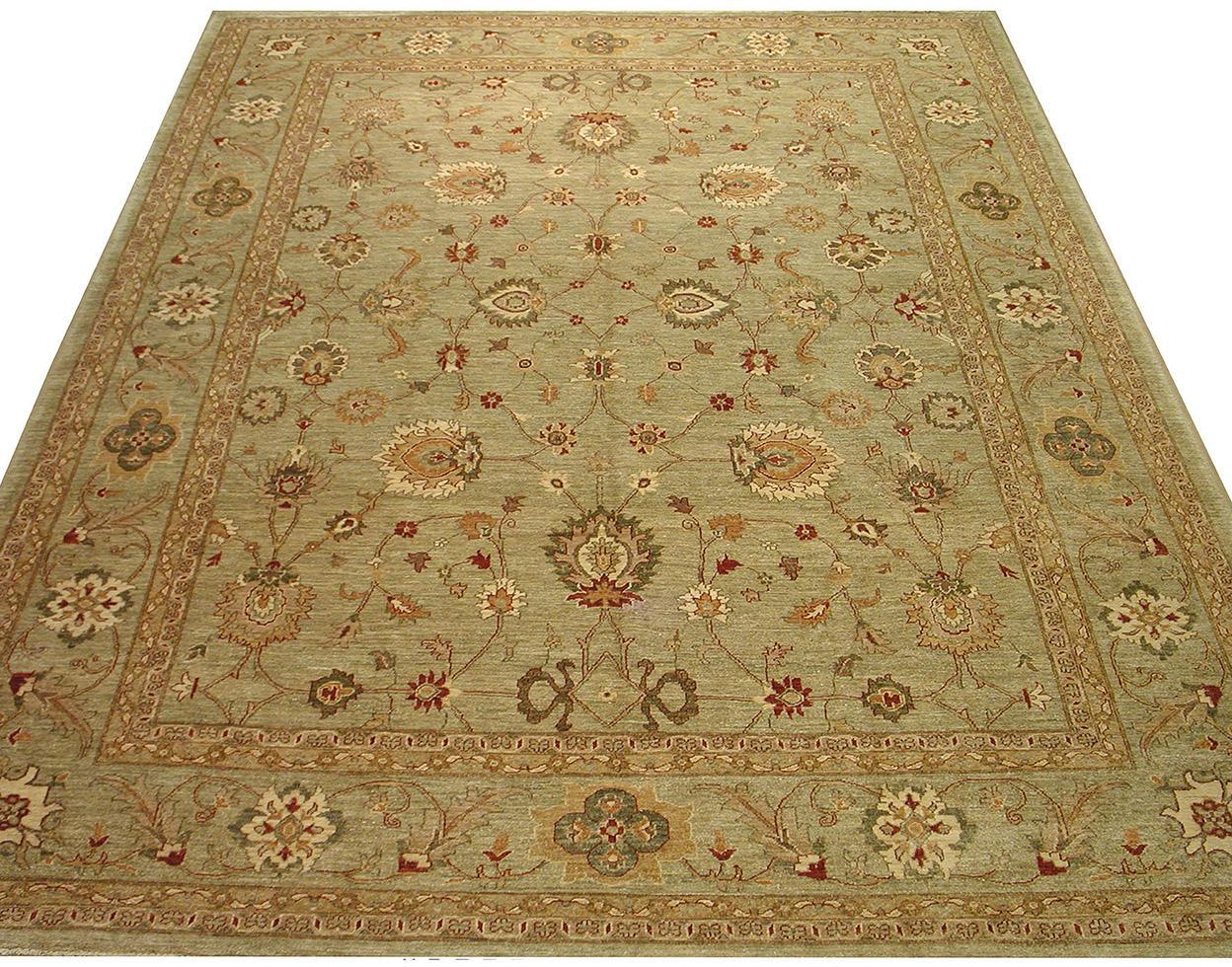 Antique Oushak reproduction rug with sage green background and floral wool design