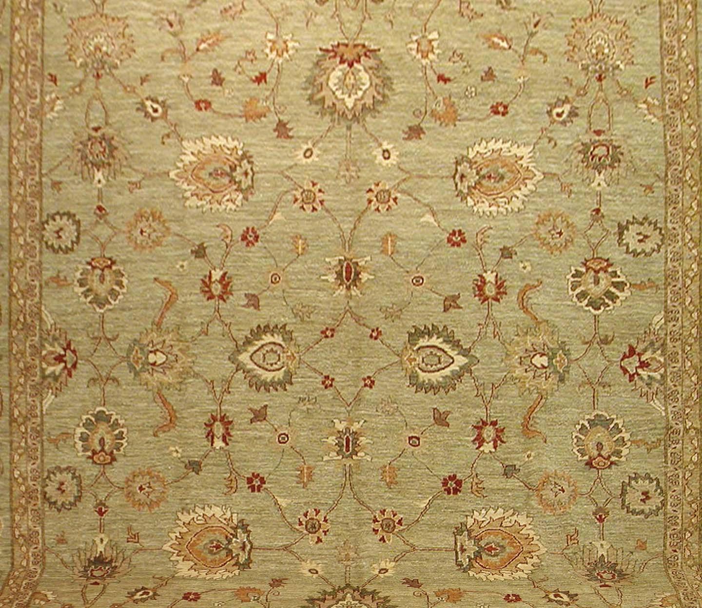 Close-up of floral design on handmade Oushak reproduction fine wool rug