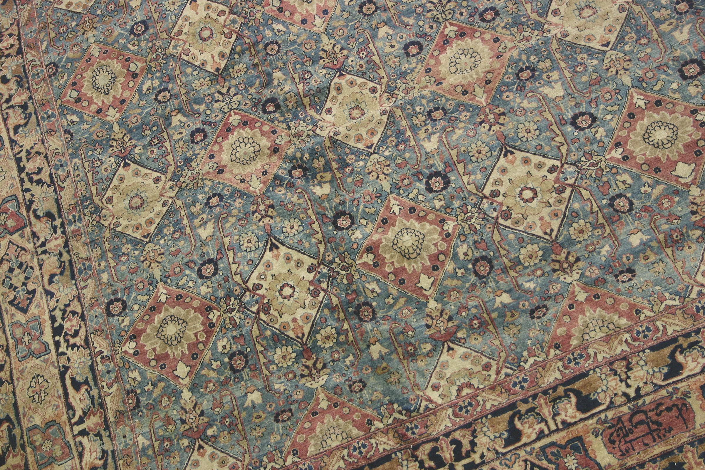 Antique Persian Kerman Shah rug with floral lattice design and soft blue tones, handwoven circa 1870s