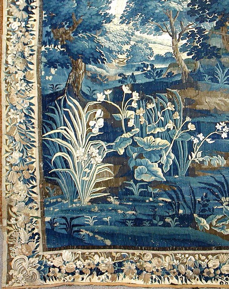 Border and color detail of antique French Verdure landscape tapestry.