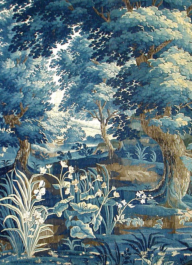 Close-up of 18th-century Verdure tapestry showing fine wool and silk weaving texture.